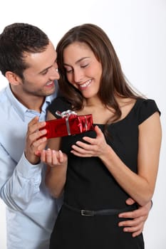 Man offering present to girlfriend