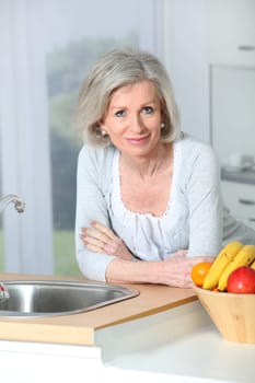 Senior woman standing in kitchen