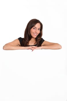 Woman in black dress showing message on white board