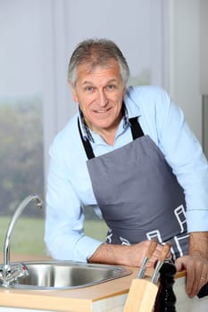 Closeup of senior man in home kitchen