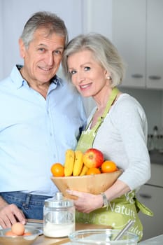 Closeup of happy senior couple in kitchen