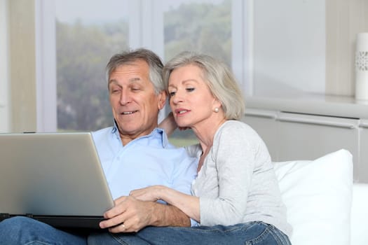 Senior couple surfing on internet
