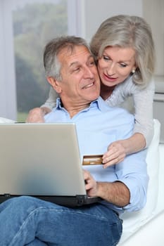 Senior couple doing online shopping