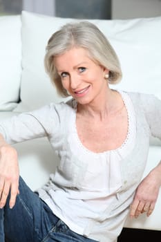 Closeup of smiling senior woman relaxing at home