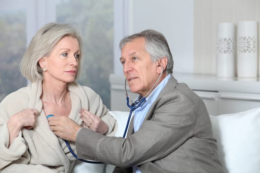 Doctor visiting patient at home