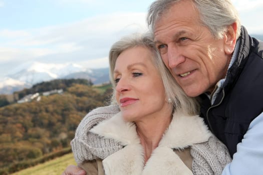 Portrait of happy senior couple in countryside