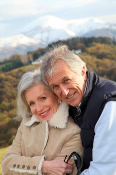 Portrait of happy senior couple in countryside