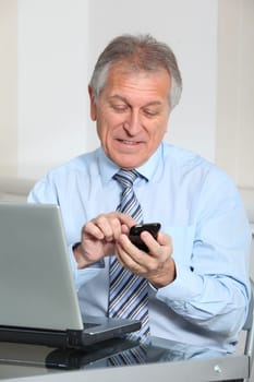 Portrait of senior businessman in office