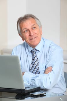 Portrait of senior businessman in office