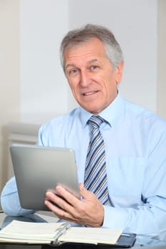 Portrait of senior businessman in office