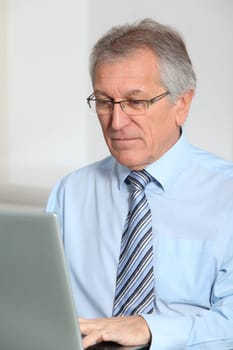 Portrait of senior businessman in office