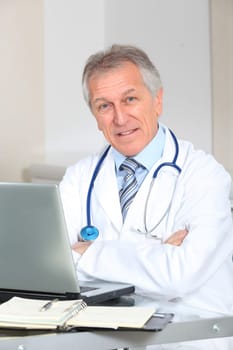 Closeup of doctor working on computer in the office
