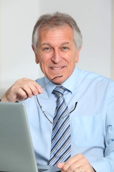Portrait of senior businessman in office