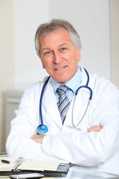 Closeup of doctor in the office with arms crossed