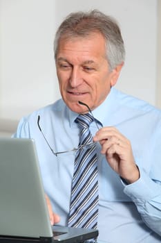 Portrait of senior businessman in office