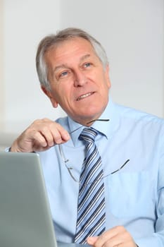 Portrait of senior businessman in office