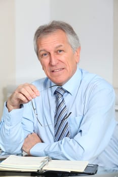 Portrait of senior businessman in office