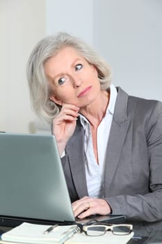 Senior businesswoman working in the office