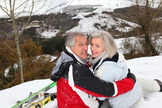 Senior couple having fun at ski resort