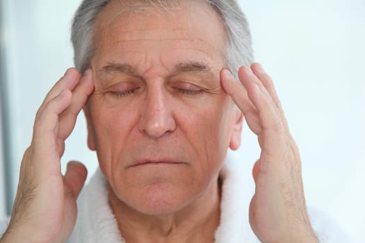 Senior man having a headache