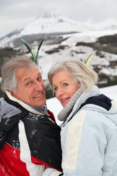 Portrait of senior couple in ski resort