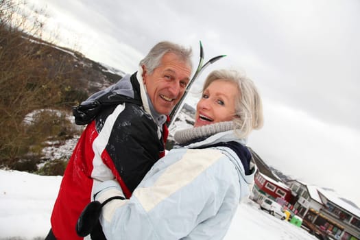 Portrait of senior couple in ski resort