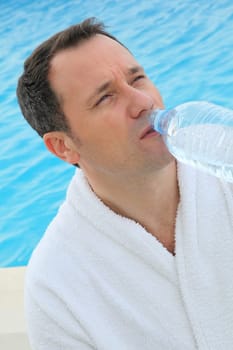Man drinking water from bottle