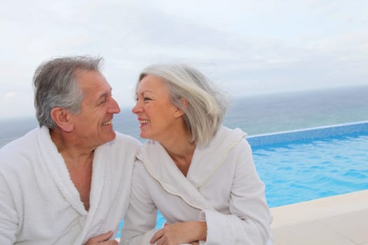 Portrait of happy senior couple in spa center