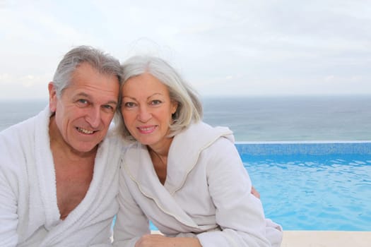 Portrait of happy senior couple in spa center