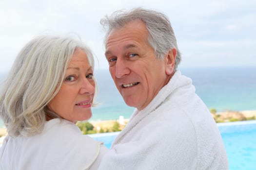 Portrait of happy senior couple in spa center