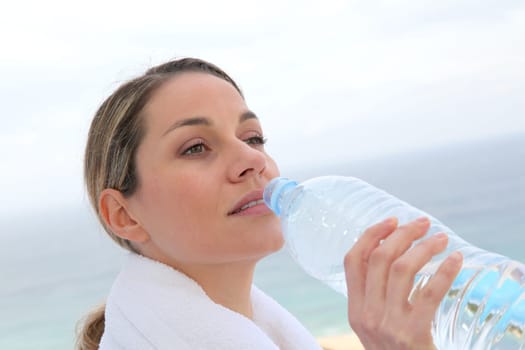 Woman drinking water from bottle