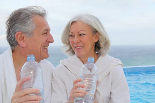 Portrait of happy senior couple in spa center