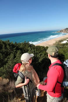 Couple looking at map on a hiking day