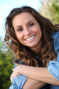 Portrait of beautiful woman relaxing in home garden