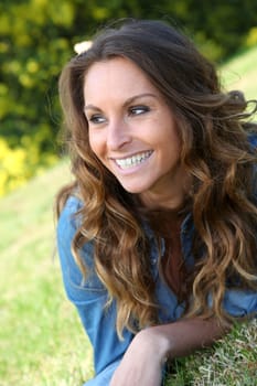 Portrait of beautiful woman relaxing in home garden
