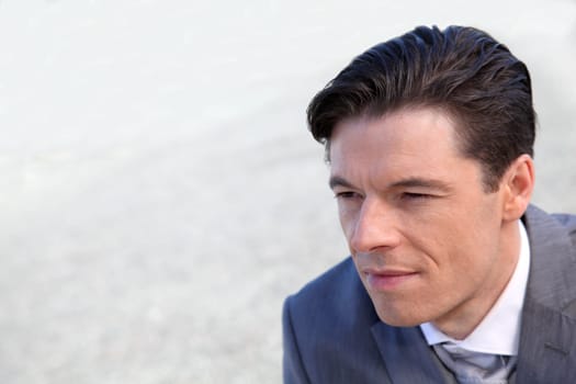 Portrait of businessman standing outside the office