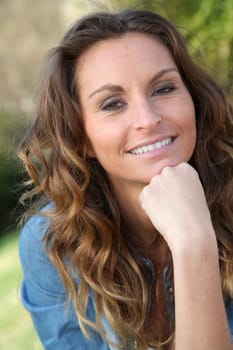 Portrait of beautiful woman relaxing in home garden
