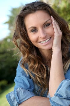 Portrait of beautiful woman relaxing in home garden
