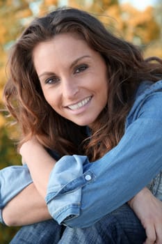 Portrait of beautiful woman relaxing in home garden