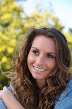 Portrait of beautiful woman relaxing in home garden