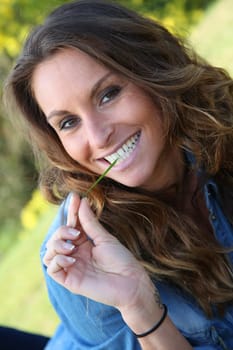 Portrait of beautiful woman relaxing in home garden