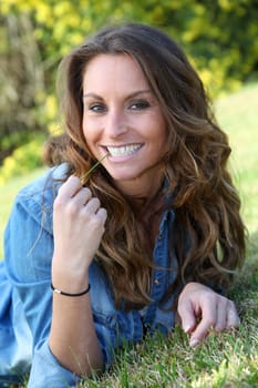Portrait of beautiful woman relaxing in home garden
