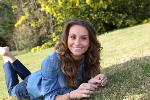 Portrait of beautiful woman relaxing in home garden