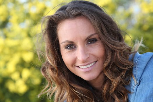 Portrait of beautiful woman relaxing in home garden