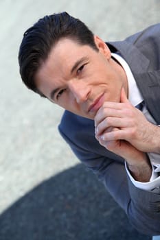 Portrait of businessman standing outside the office