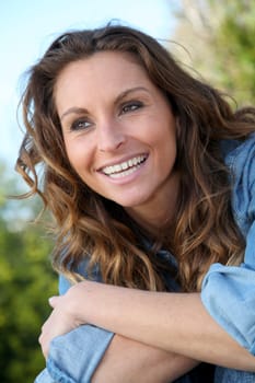 Portrait of beautiful woman relaxing in home garden