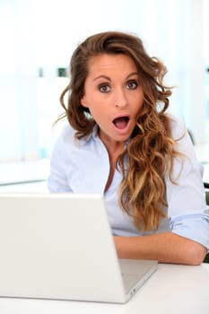 Portrait of office worker with surpised look