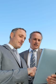 Businessmen meeting outside the office