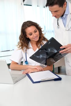 Doctor and nurse looking at xray results