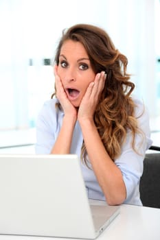 Portrait of office worker with surpised look